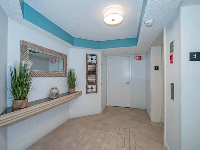 a dining room with furniture entryway and wooden floor