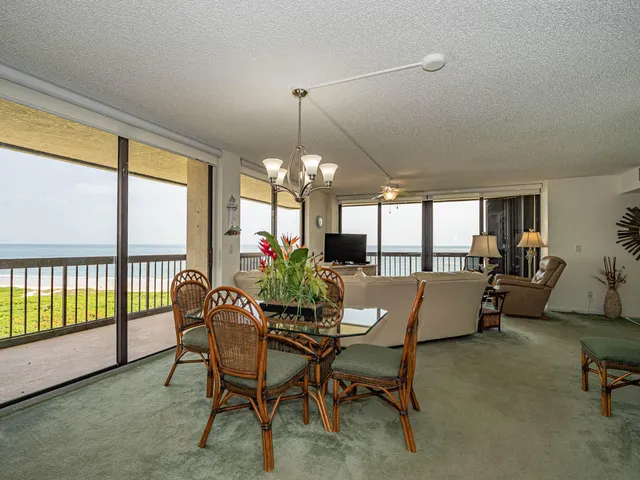 a bathroom with a granite countertop sink a large mirror and a shower