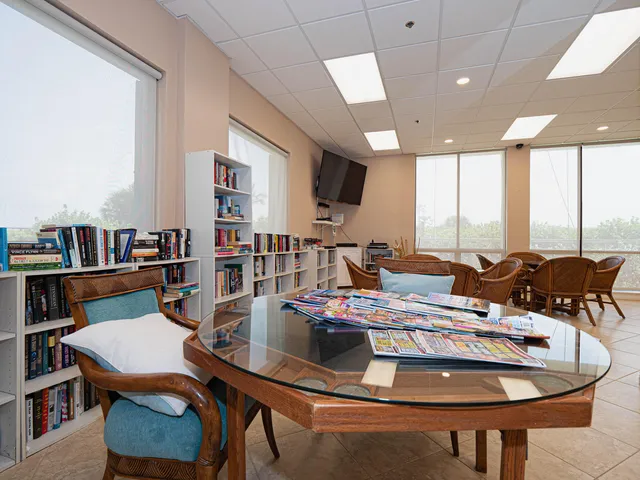 a view of a backyard with sitting area