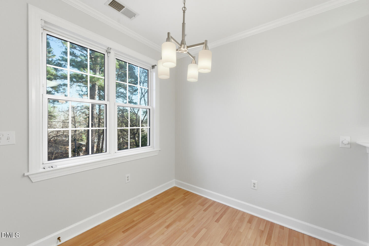 116 Northbrook Drive, Unit 204 Raleigh, NC 27609 - Photo 26 of 94 an empty room with a window and wooden floor