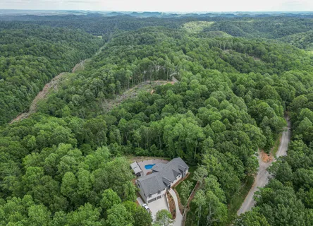 an aerial view of a house with outdoor space