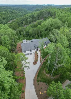 a aerial view of a house with a yard