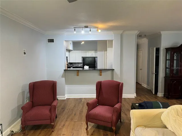 a kitchen with stainless steel appliances a stove a sink and a microwave