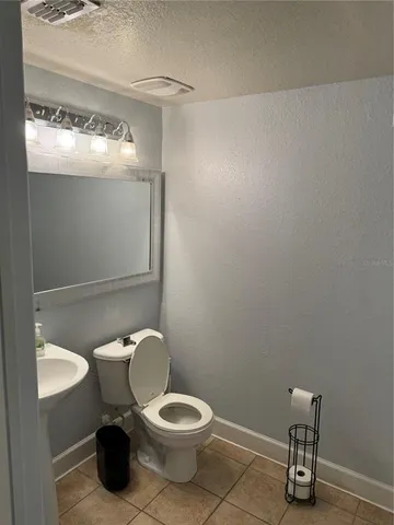 a kitchen with a refrigerator and a stove