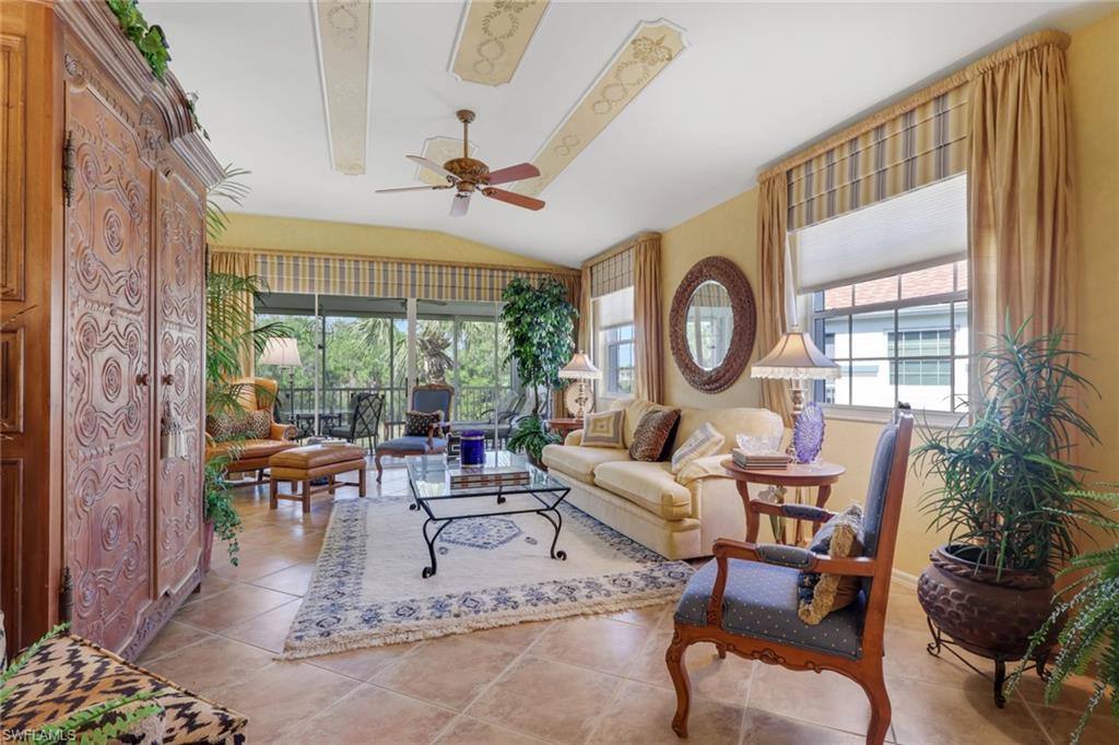 10801 Crooked River Road, Unit 203 Estero, FL 34135 - Photo 17 of 27 a living room with fireplace furniture and a large window