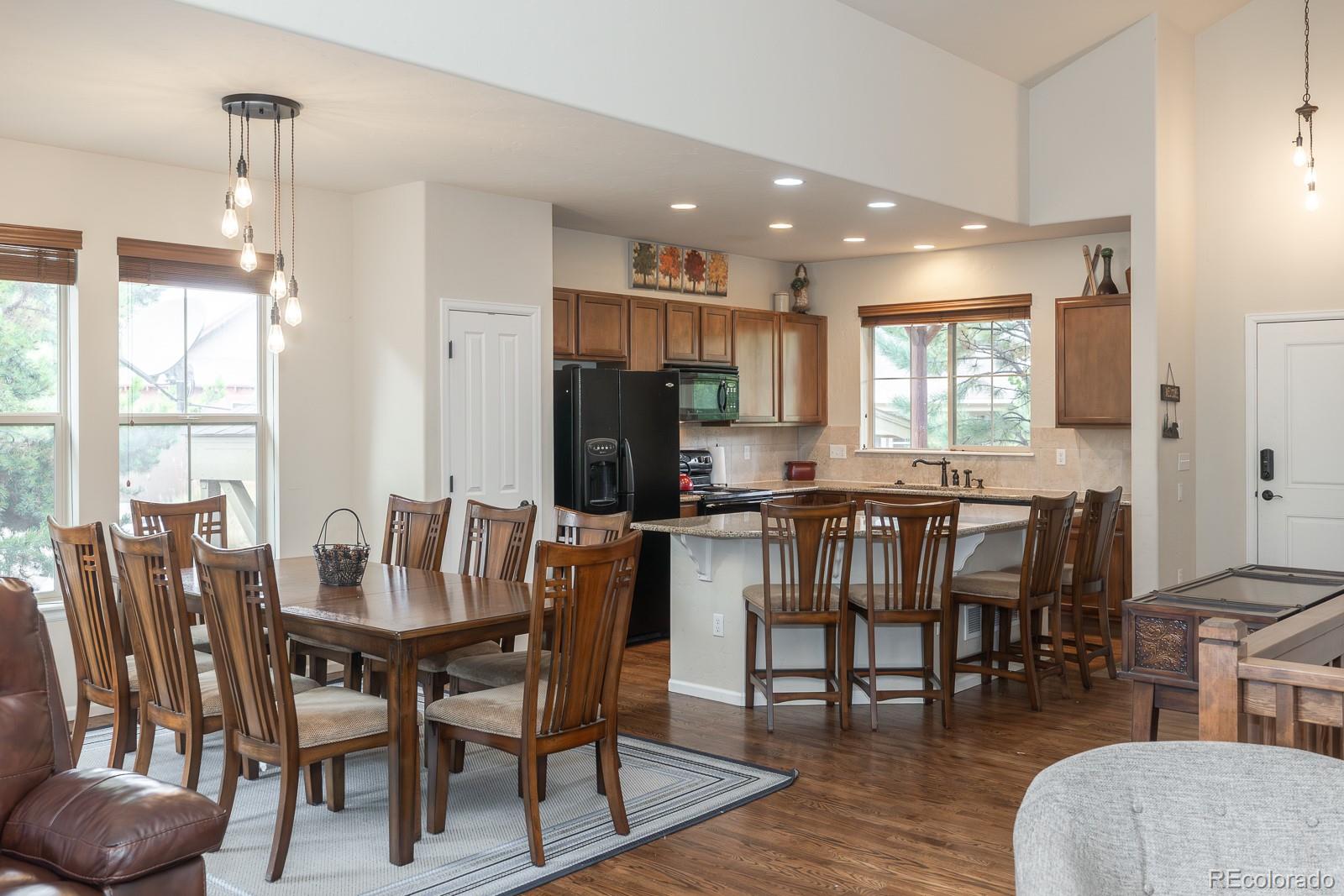 103 Timber Court Granby, CO 80446 - Photo 12 of 50 a view of a dining room with furniture and wooden floor