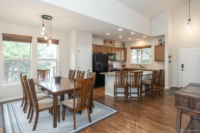 a view of a dining room with furniture window and wooden floor
