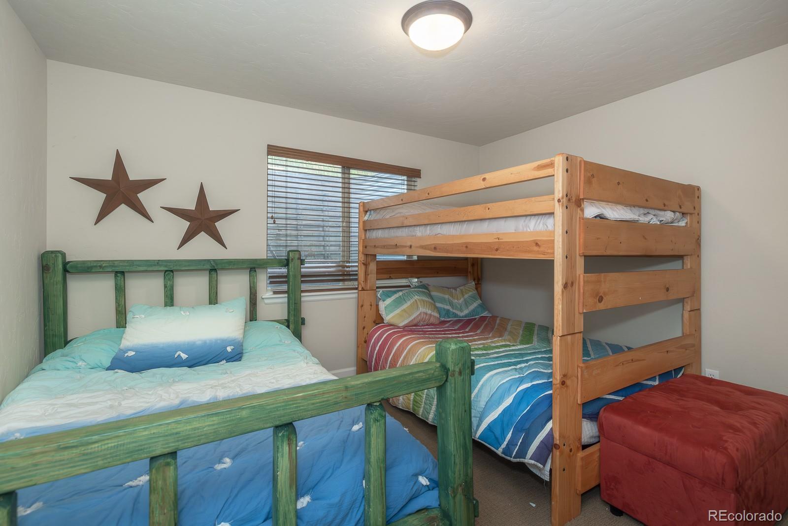 103 Timber Court Granby, CO 80446 - Photo 31 of 50 a bedroom with a bed and a window