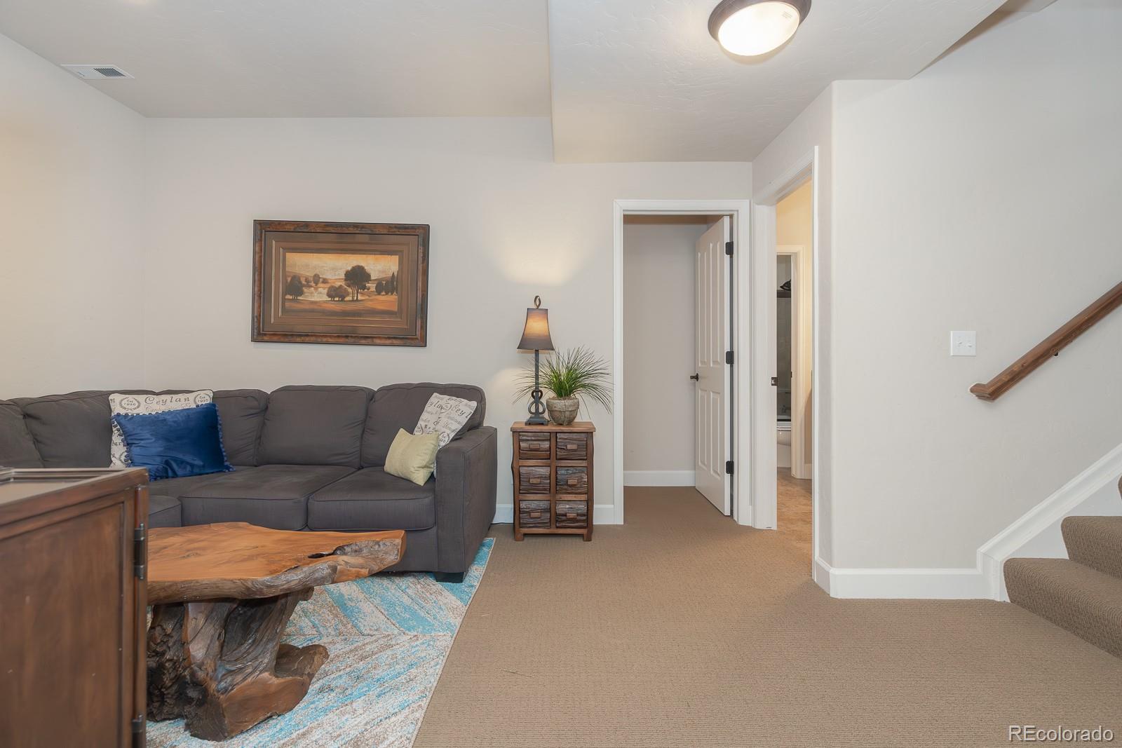 103 Timber Court Granby, CO 80446 - Photo 34 of 50 a living room with furniture and a hallway