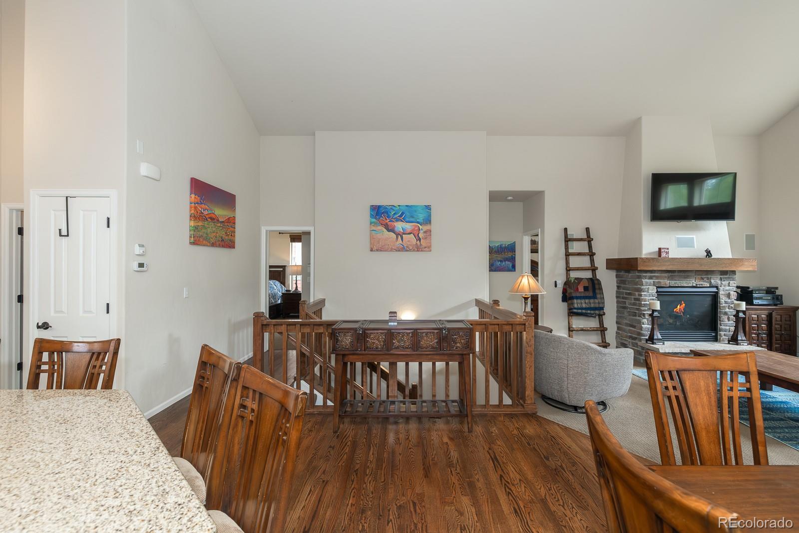 103 Timber Court Granby, CO 80446 - Photo 36 of 50 a view of a dining room with furniture and wooden floor