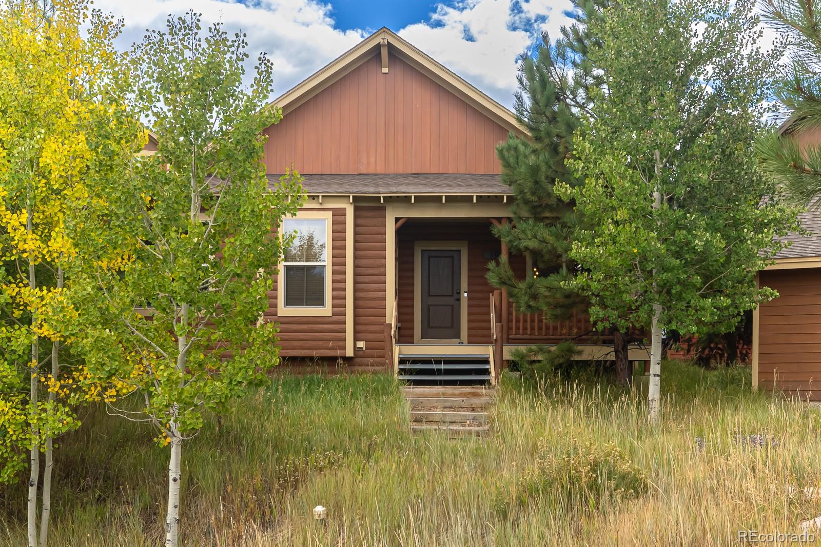 103 Timber Court Granby, CO 80446 - Photo 42 of 50 a front view of a house with a yard
