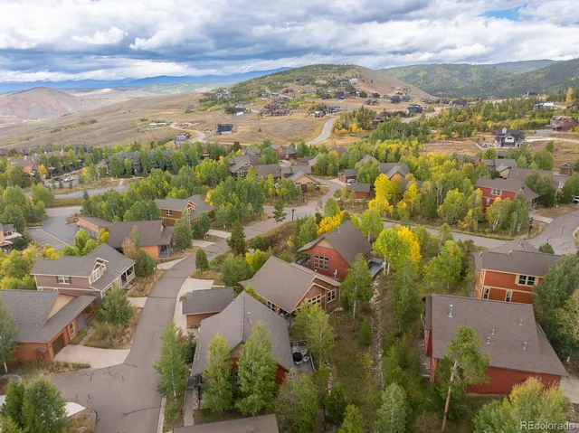 an aerial view of residential houses with outdoor space