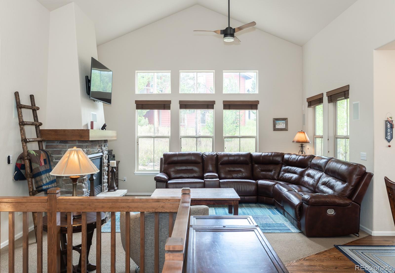 103 Timber Court Granby, CO 80446 - Photo 5 of 50 a living room with furniture fireplace and a window