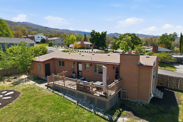 935 900 North Bountiful, UT 84010 - Photo 43 of 46 Back of property with a deck with mountain view and a residential view