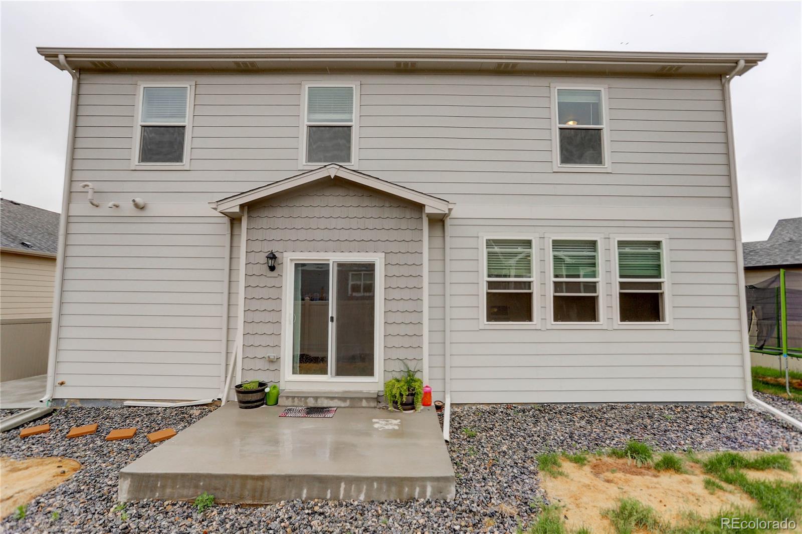 7104 Morrison Drive Frederick, CO 80530 - Photo 12 of 33 a view of a house with small yard