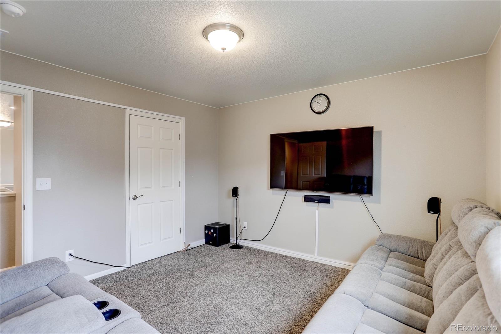 7104 Morrison Drive Frederick, CO 80530 - Photo 18 of 33 a living room with furniture and a flat screen tv