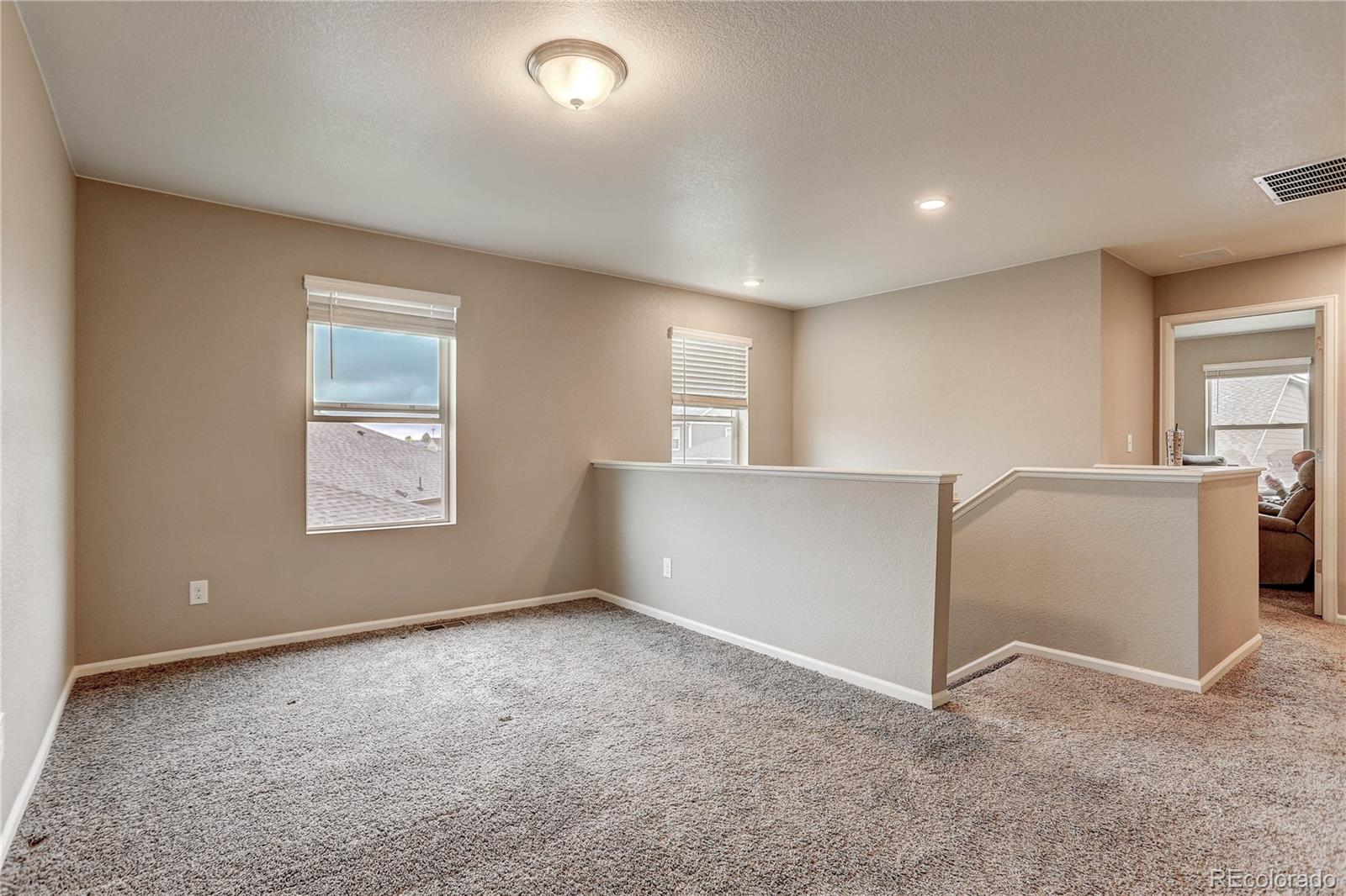 7104 Morrison Drive Frederick, CO 80530 - Photo 23 of 33 a view of an empty room with a window