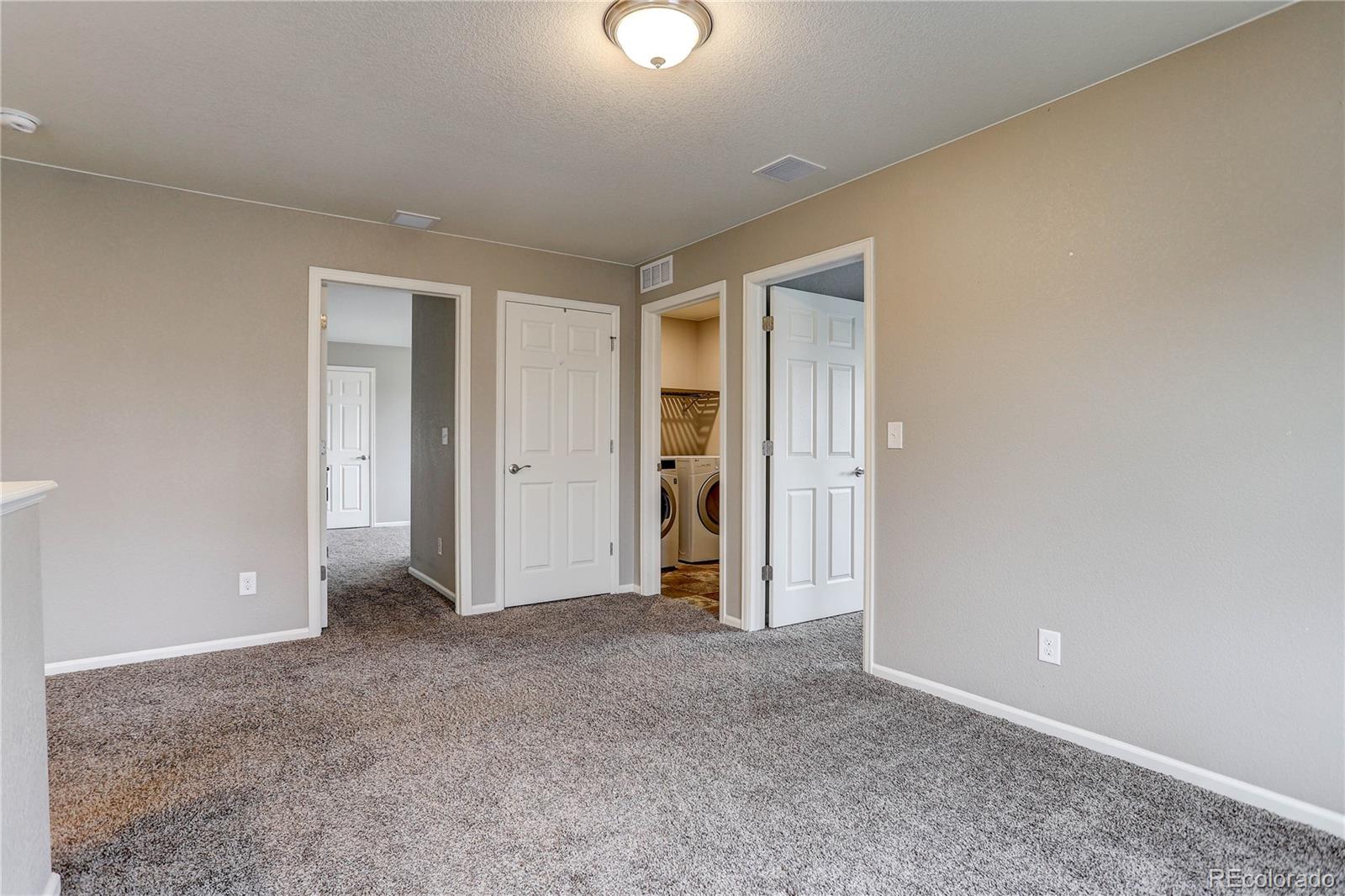 7104 Morrison Drive Frederick, CO 80530 - Photo 24 of 33 an empty room with closet and mirror
