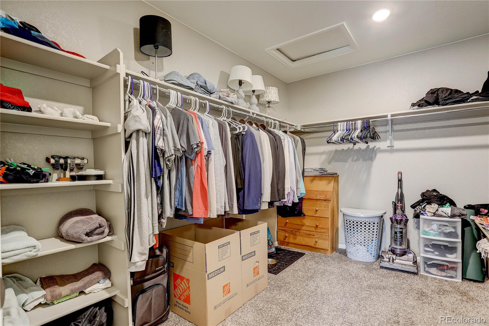 7104 Morrison Drive Frederick, CO 80530 - Photo 29 of 33 a view of walk in closet with clothes and shoes