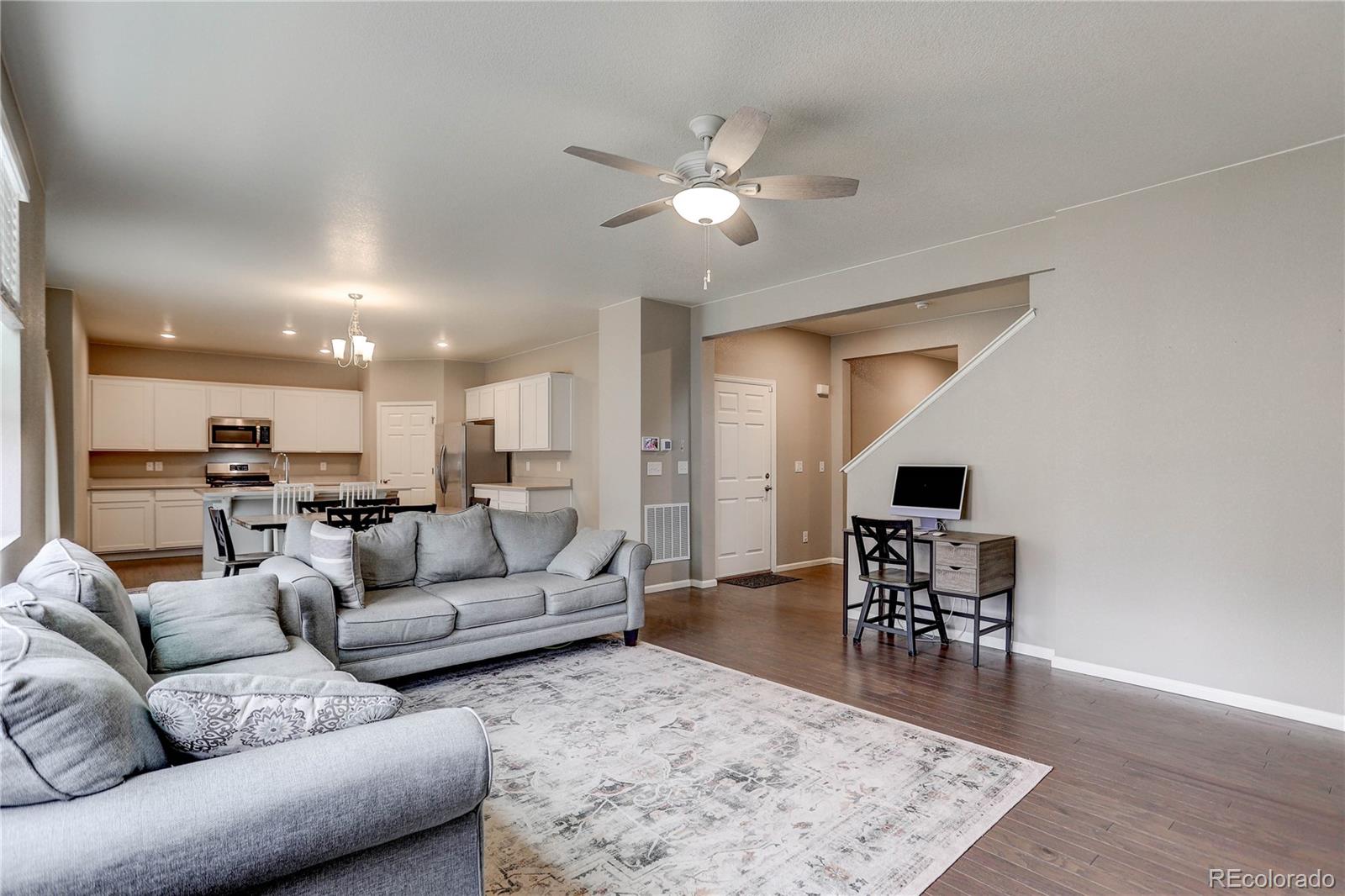 7104 Morrison Drive Frederick, CO 80530 - Photo 4 of 33 a living room with furniture and wooden floor