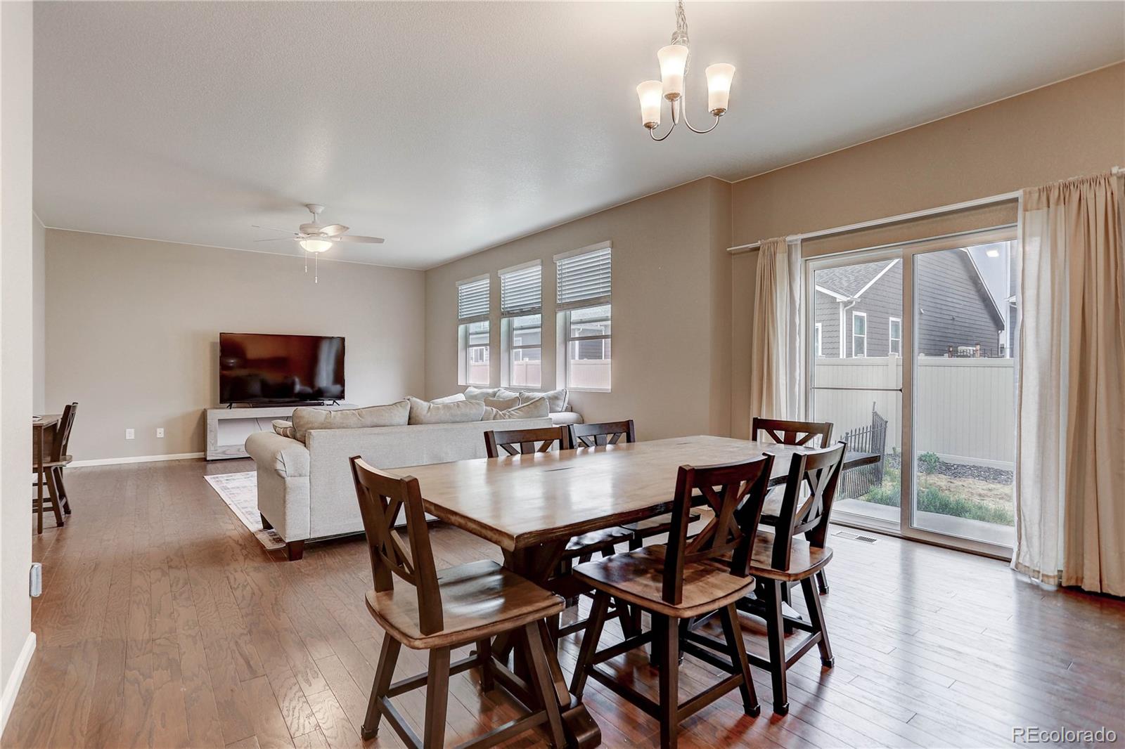 7104 Morrison Drive Frederick, CO 80530 - Photo 7 of 33 a dining room with furniture window and wooden floor