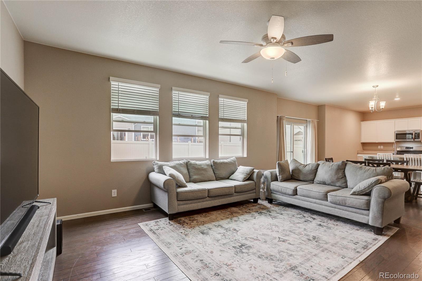 7104 Morrison Drive Frederick, CO 80530 - Photo 8 of 33 a living room with furniture and a large window