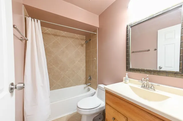 a bathroom with a sink a toilet and a bathtub