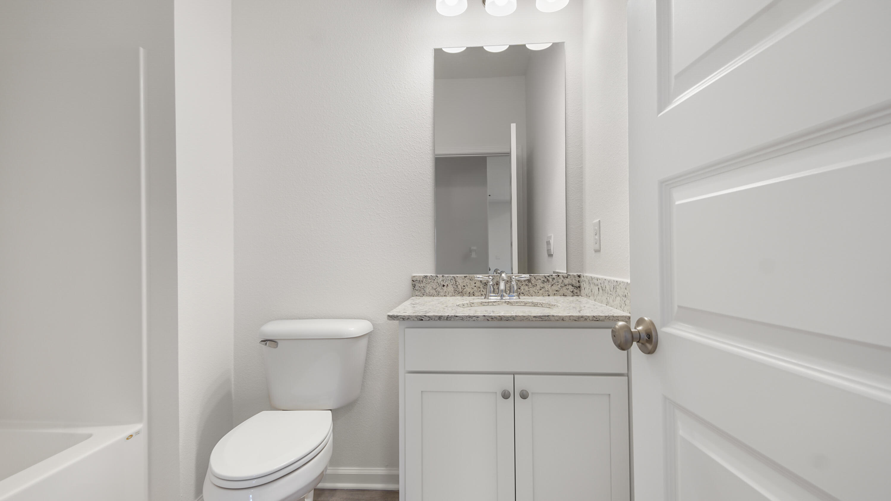 214 Sweetthorn Street Freeport, FL 32439 - Photo 13 of 36 a bathroom with a granite countertop sink toilet and shower