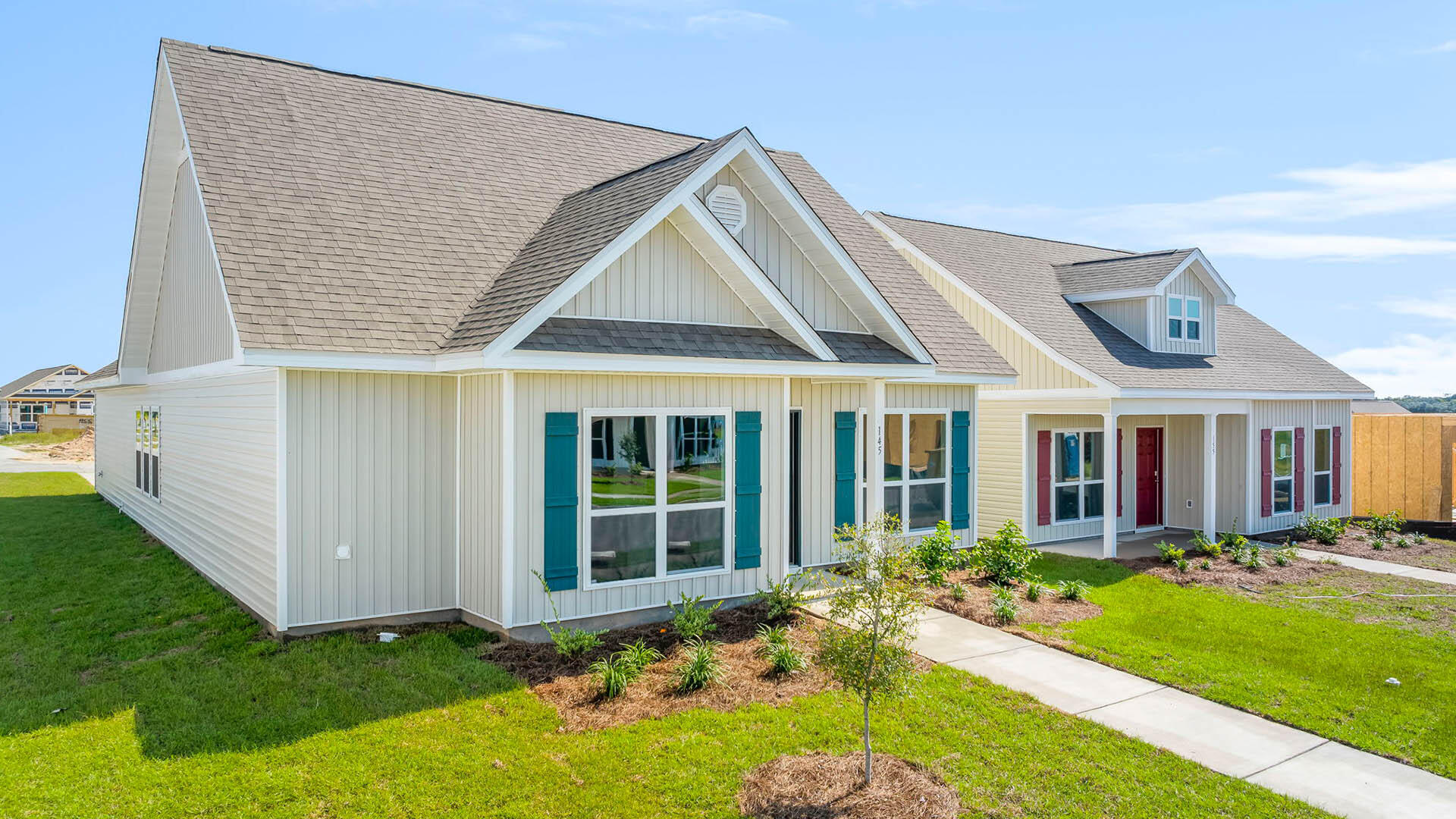 214 Sweetthorn Street Freeport, FL 32439 - Photo 2 of 36 a front view of a house with garden