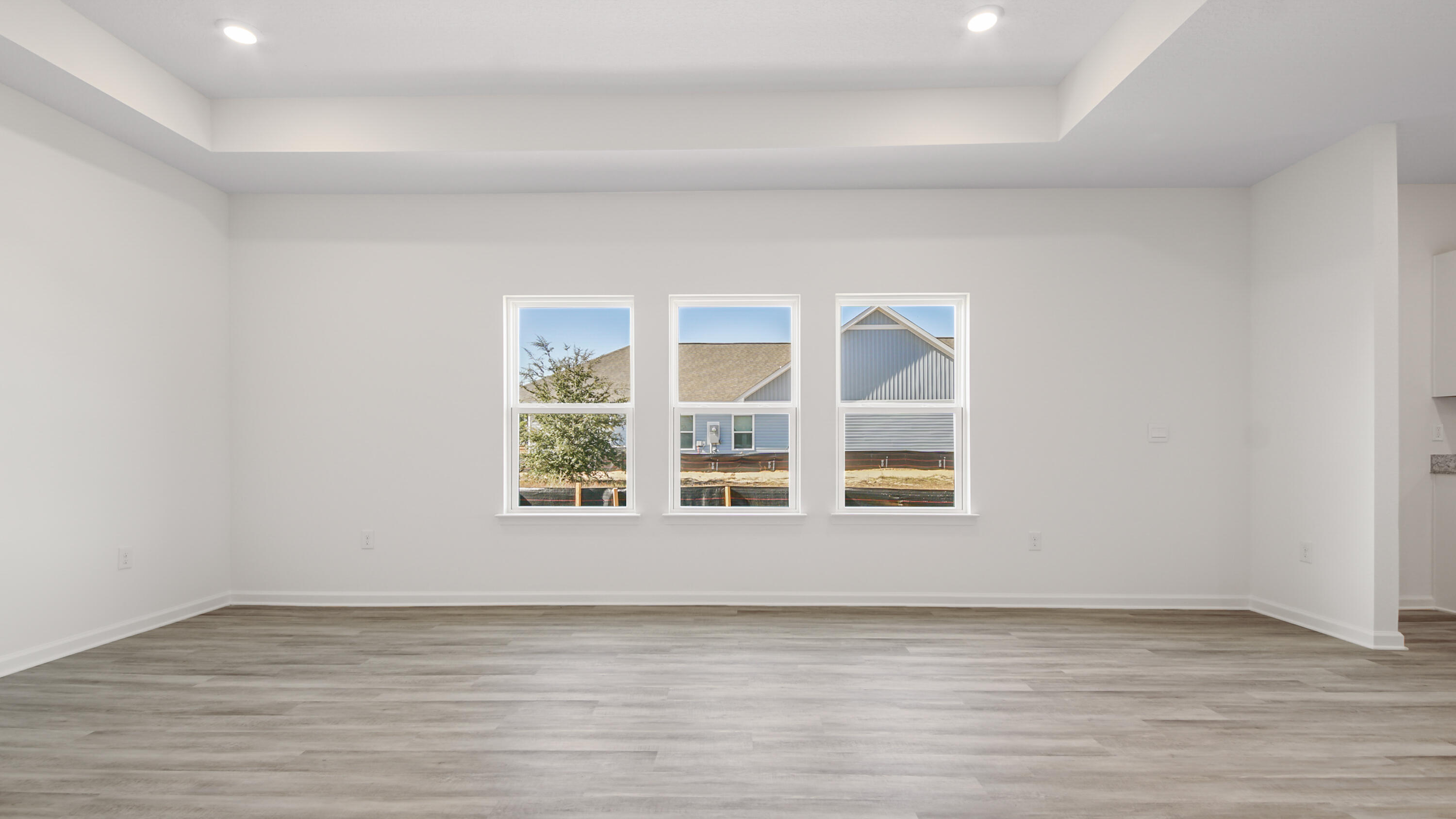 214 Sweetthorn Street Freeport, FL 32439 - Photo 20 of 36 a view of an empty room with wooden floor and a window