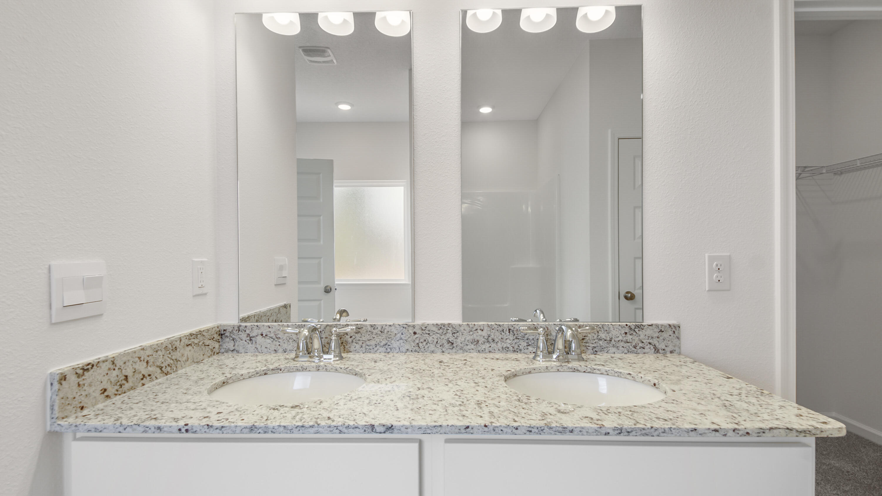 214 Sweetthorn Street Freeport, FL 32439 - Photo 25 of 36 a bathroom with a granite countertop sink and a mirror