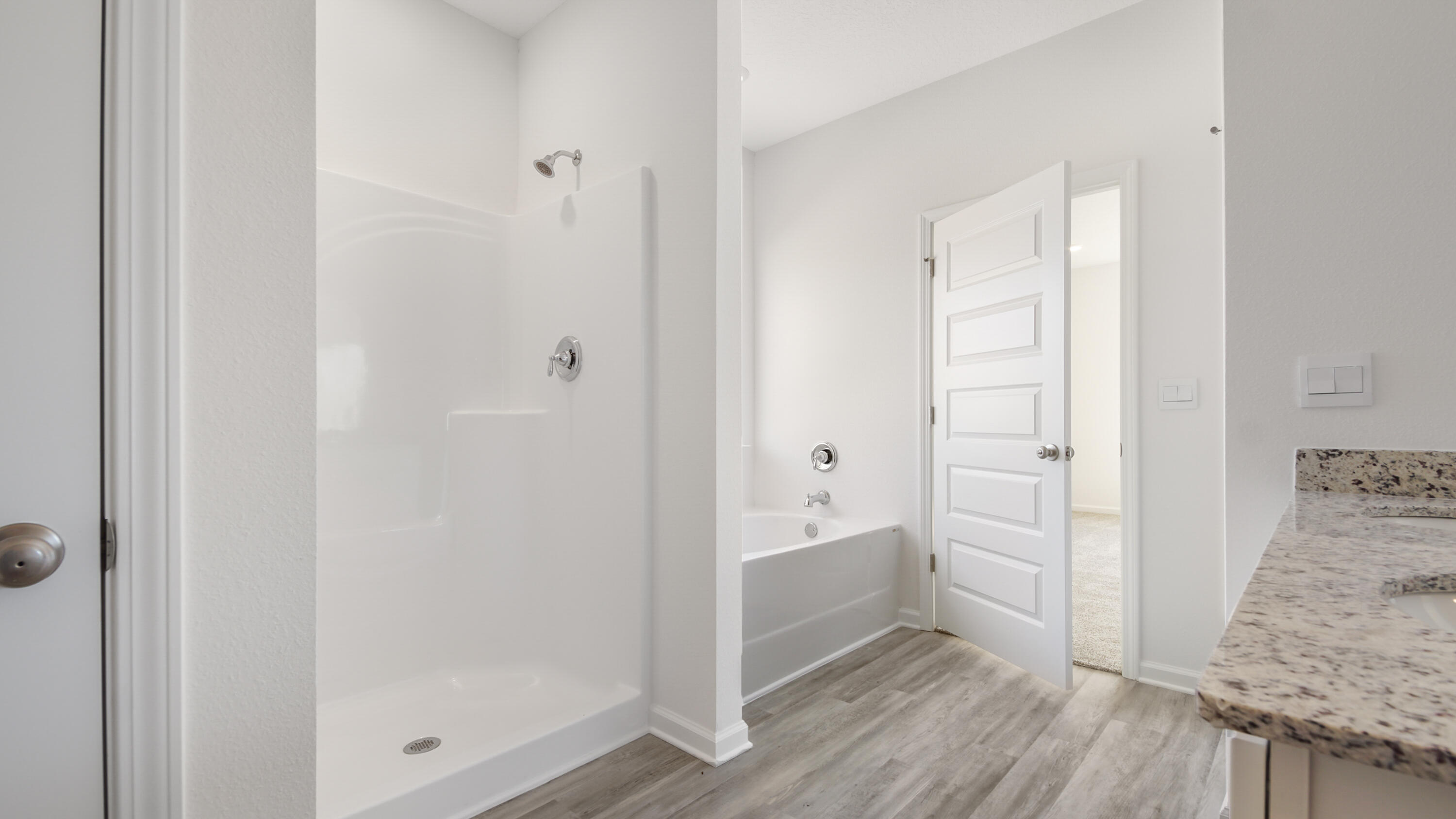 214 Sweetthorn Street Freeport, FL 32439 - Photo 27 of 36 a bathroom with a tub and shower