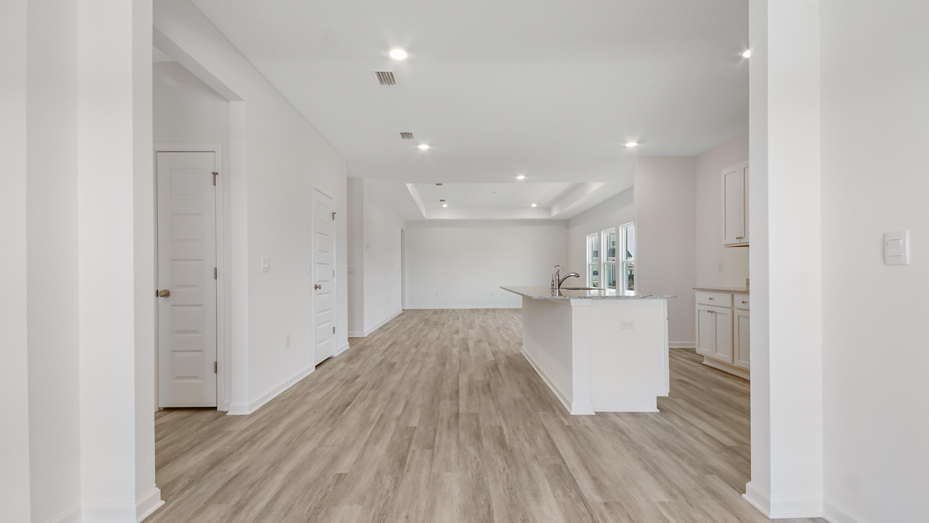 214 Sweetthorn Street Freeport, FL 32439 - Photo 4 of 36 a view of a kitchen with wooden floor