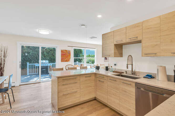 209 Howe Street Point Pleasant, NJ 08742 - Photo 14 of 27 a kitchen with a sink and cabinets