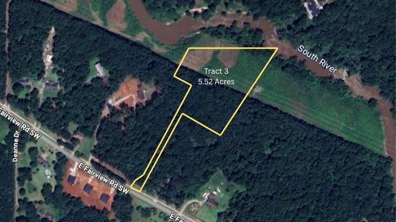an aerial view of house with outdoor space and swimming pool