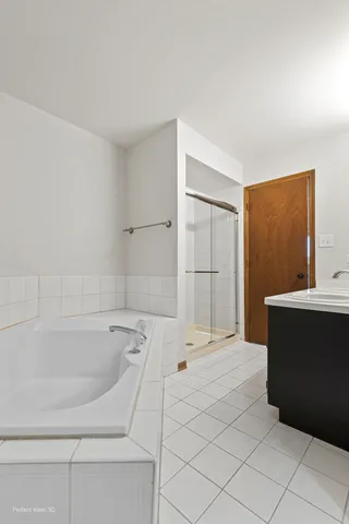 a bathroom with a bathtub and a sink