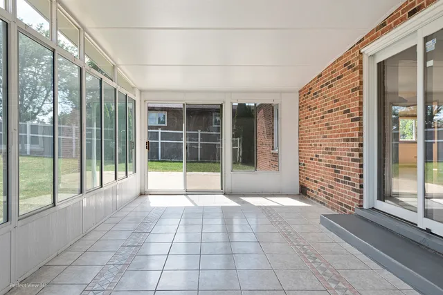 a view of a porch with a floor to ceiling window