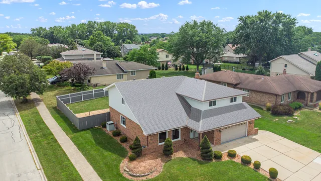 an aerial view of a house with a garden