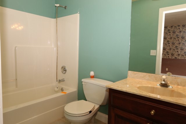 157 Gates Road Lizella, GA 31052 - Photo 17 of 30 a bathroom with a sink a toilet and shower