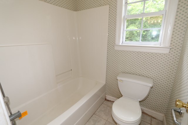 157 Gates Road Lizella, GA 31052 - Photo 27 of 30 a white toilet sitting next to a bath tub