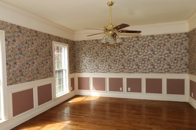 157 Gates Road Lizella, GA 31052 - Photo 6 of 30 a view of a livingroom with wooden floor and a ceiling fan