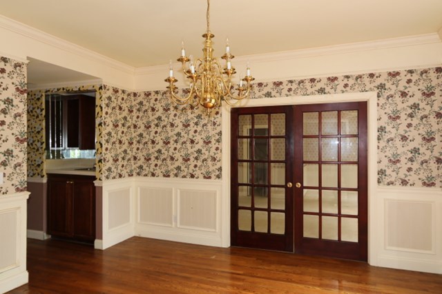 157 Gates Road Lizella, GA 31052 - Photo 7 of 30 a view of a kitchen with wooden floor and a floor to ceiling window
