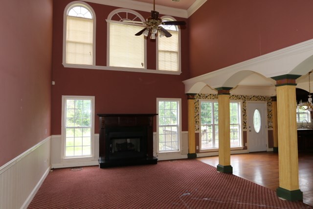 157 Gates Road Lizella, GA 31052 - Photo 8 of 30 a view of an empty room with a fireplace and a window