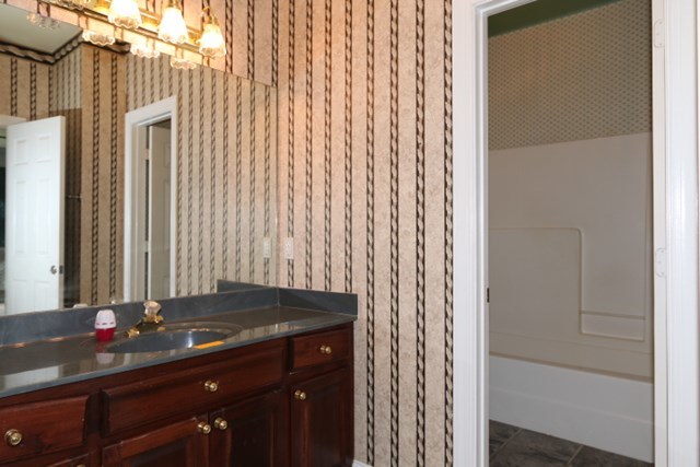 157 Gates Road Lizella, GA 31052 - Photo 9 of 30 a bathroom with a granite countertop sink and a mirror