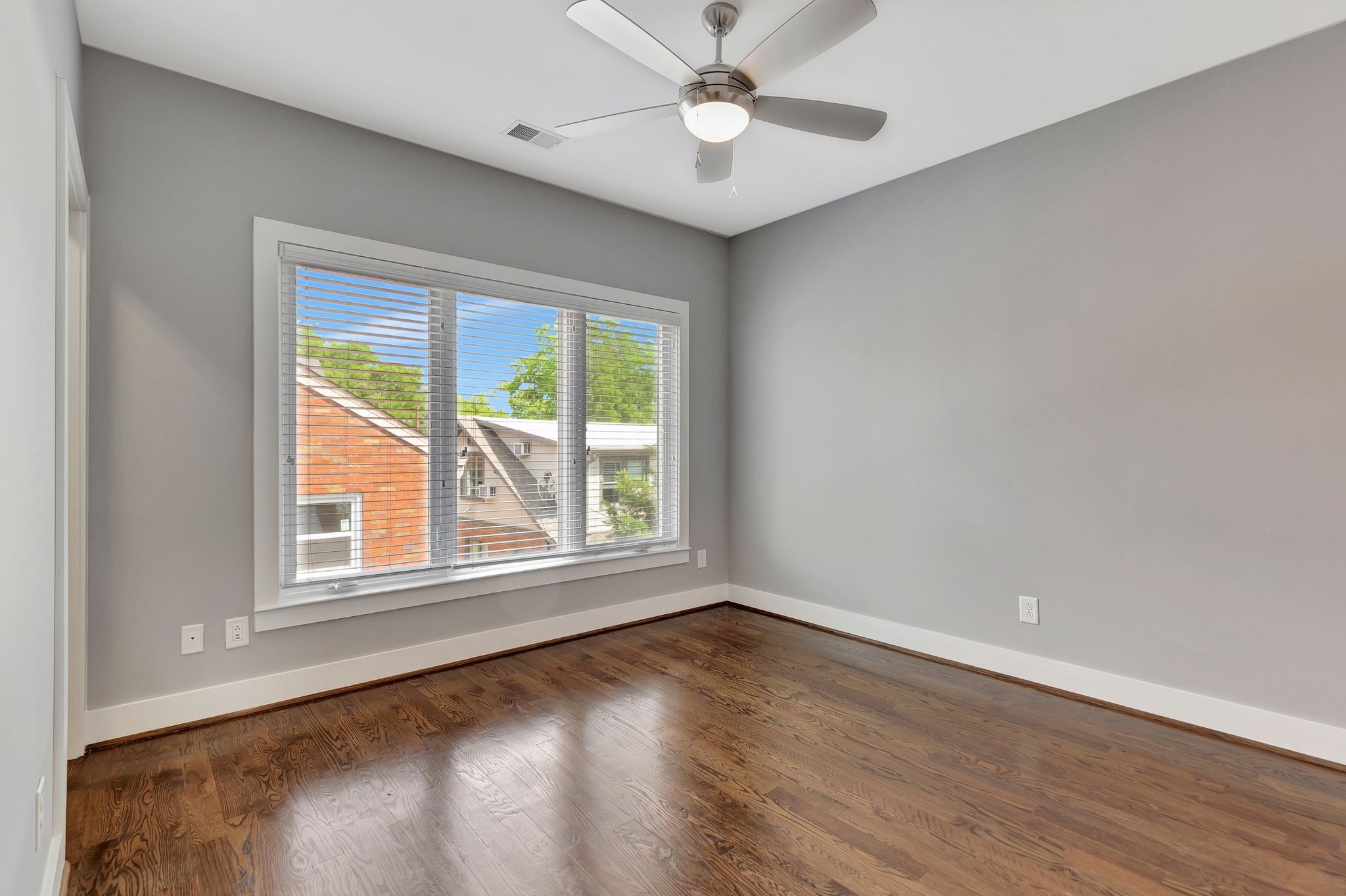 2003 Convent Place, Unit 9 Nashville, TN 37212 - Photo 21 of 31 an empty room with wooden floor and windows