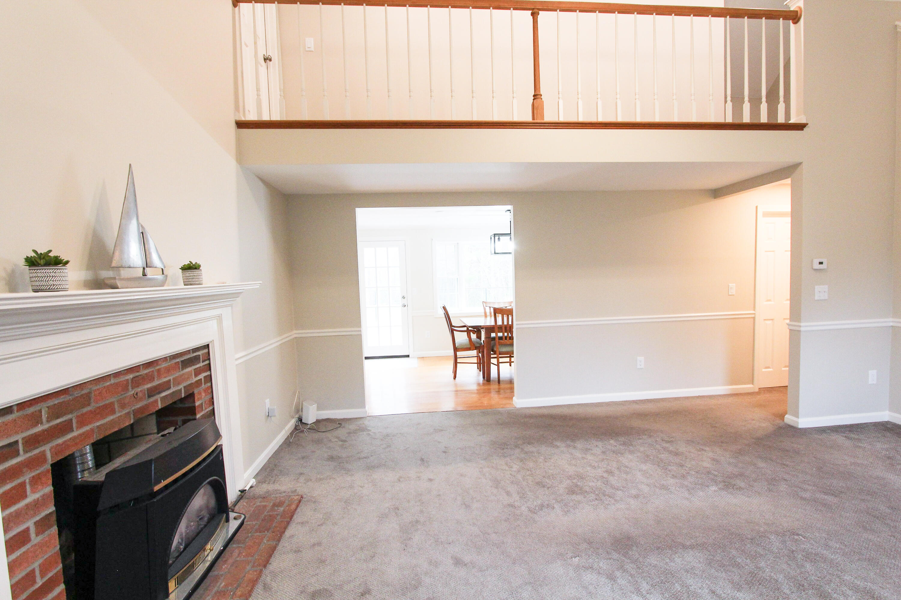 199 Skunknet Road Centerville, MA 02632 - Photo 15 of 37 a view of empty room with cabinet and fireplace