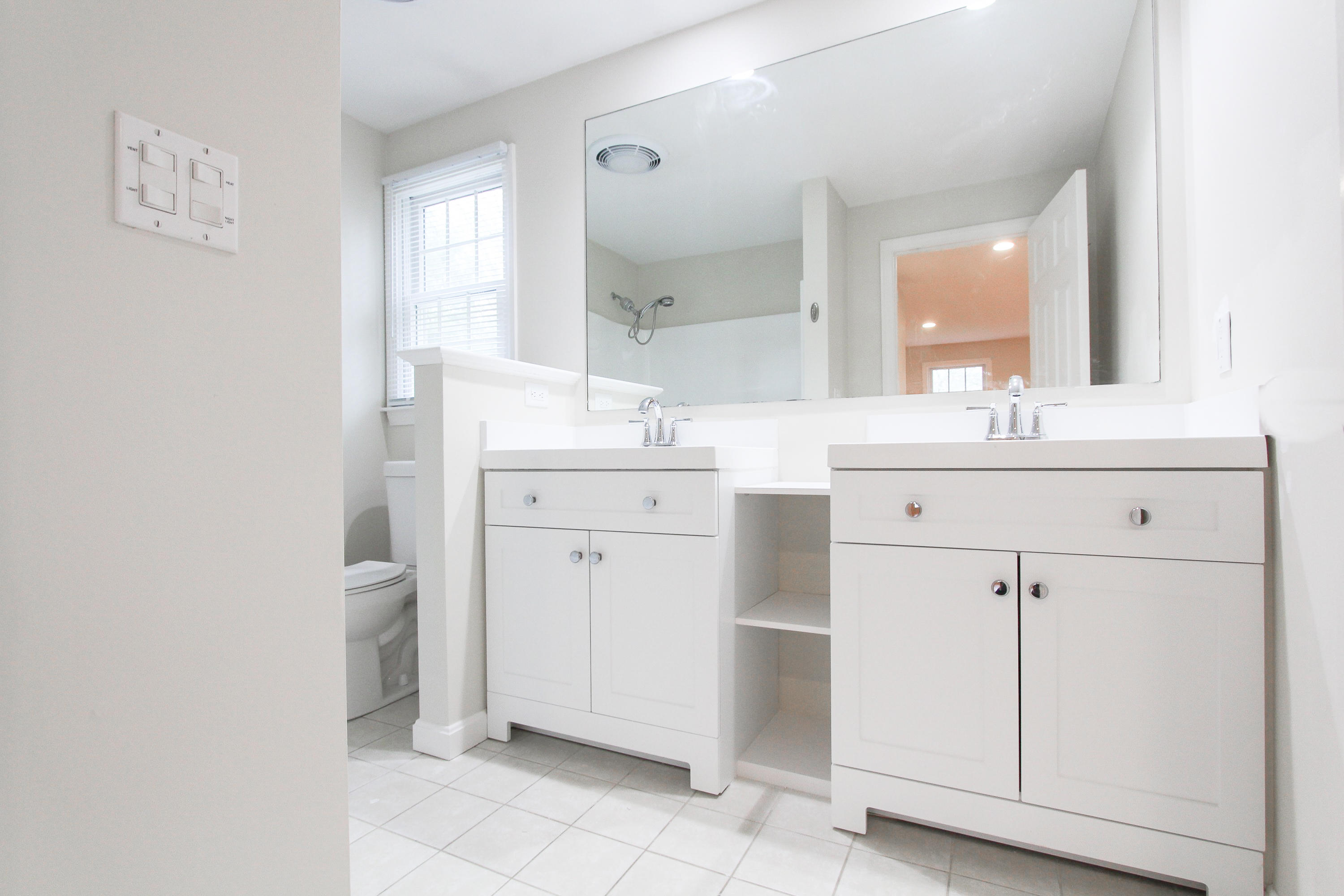 199 Skunknet Road Centerville, MA 02632 - Photo 19 of 37 a bathroom with a sink and a mirror