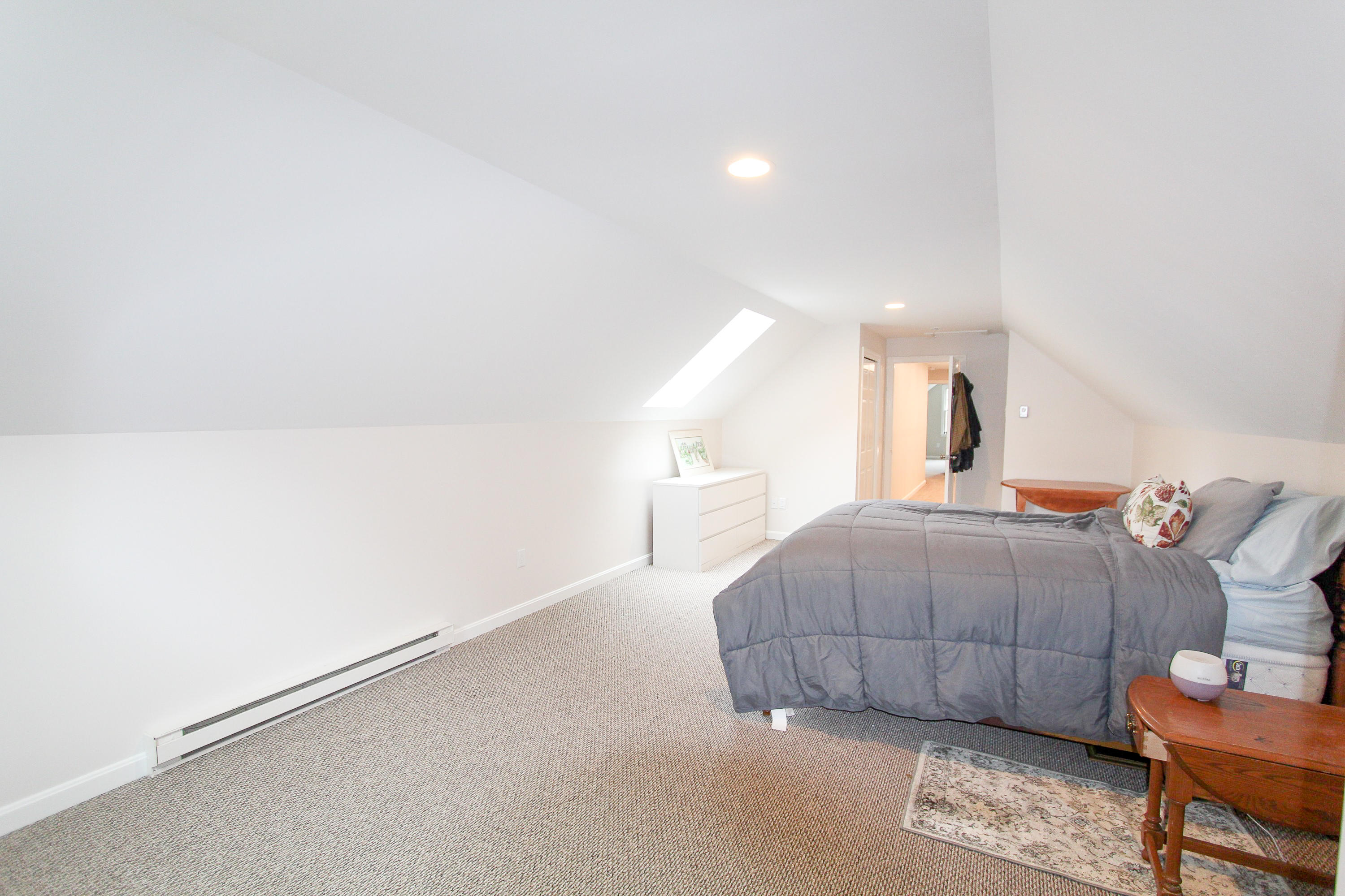 199 Skunknet Road Centerville, MA 02632 - Photo 26 of 37 a room with a bed and a night stand