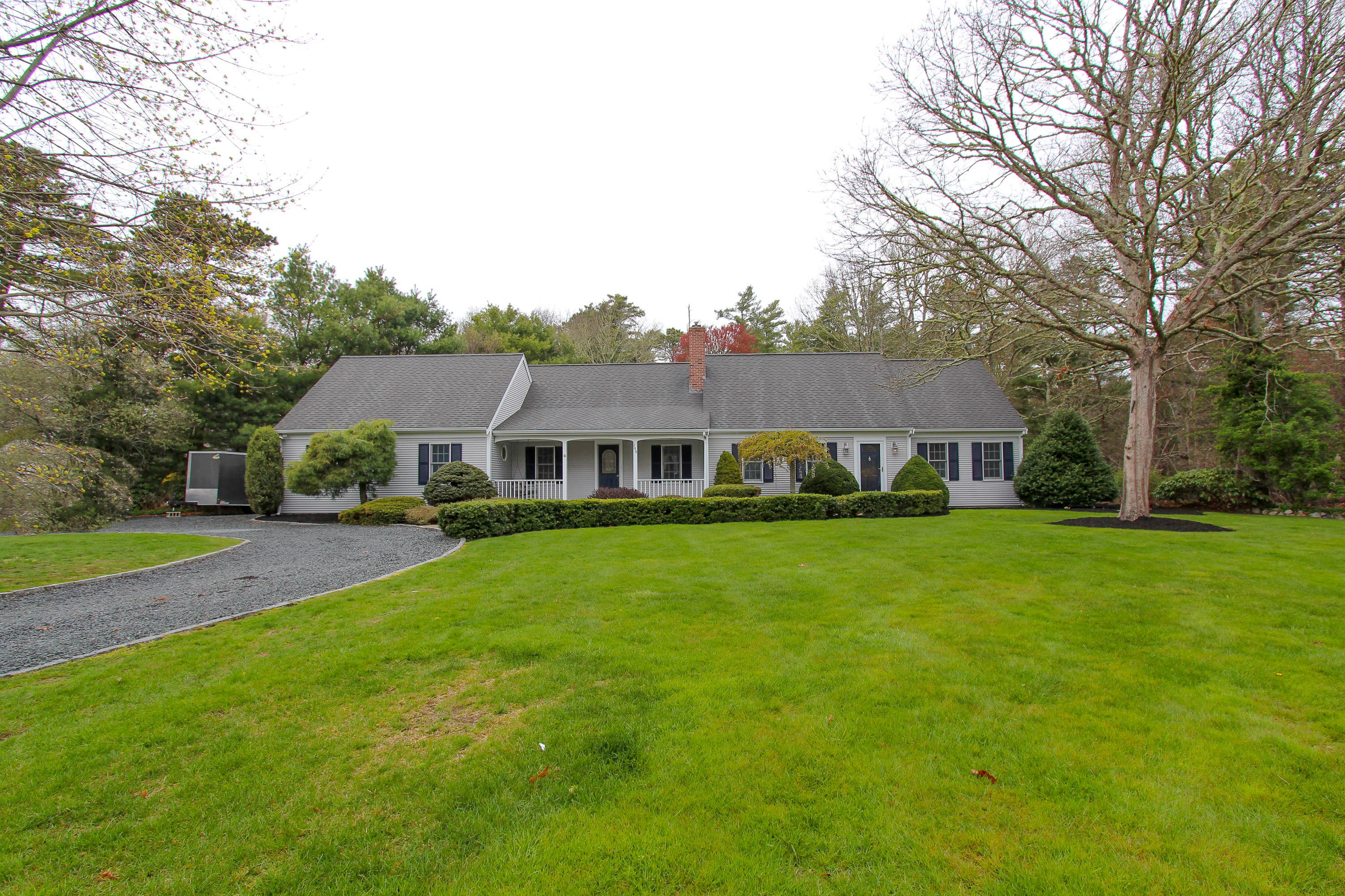 199 Skunknet Road Centerville, MA 02632 - Photo 33 of 37 a front view of a house with garden