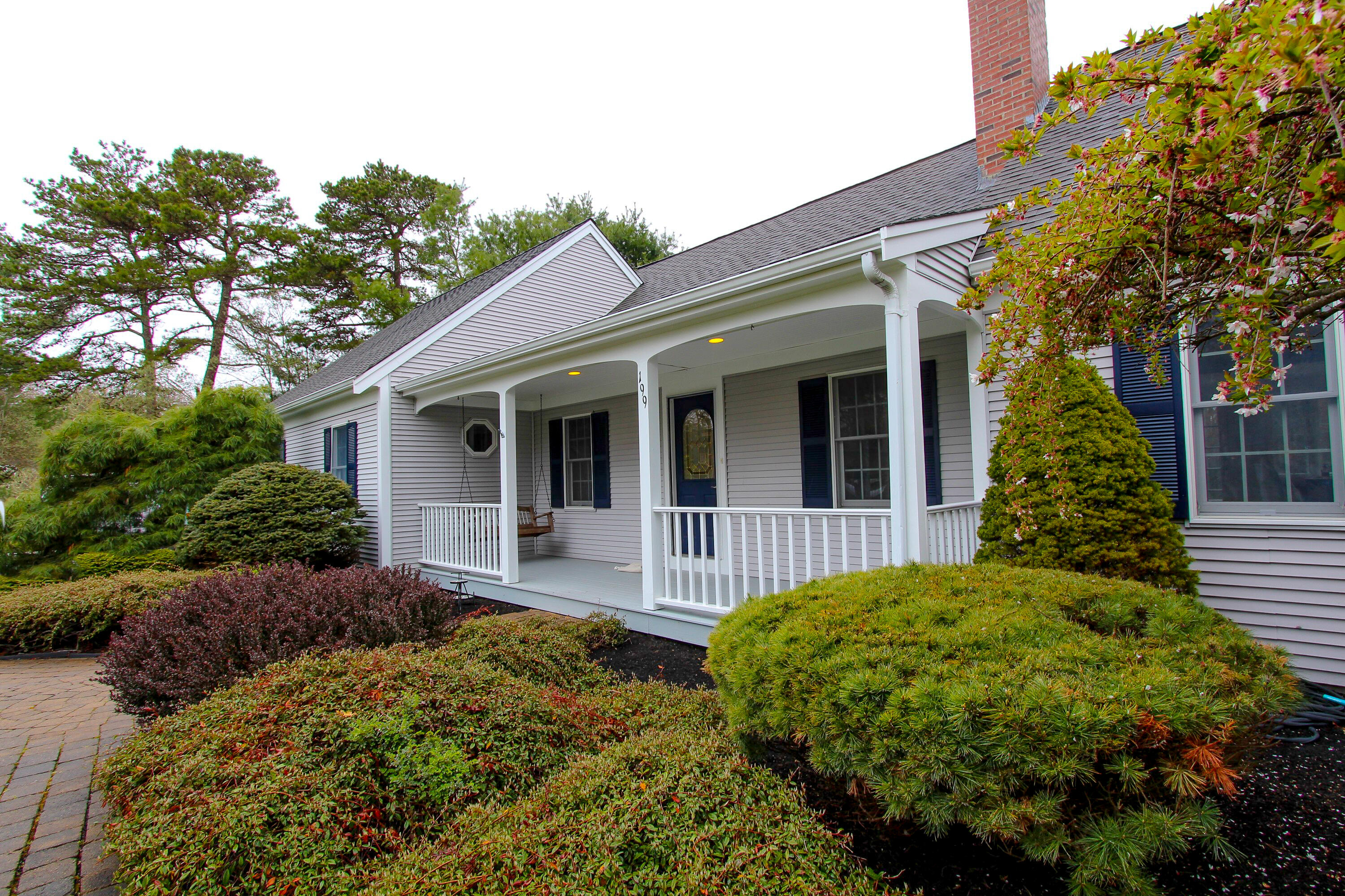 199 Skunknet Road Centerville, MA 02632 - Photo 36 of 37 front view of a house with a garden